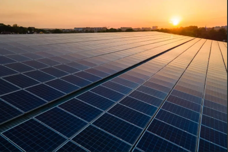 Illustrative rooftop solar modules at sunset